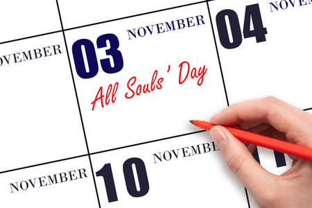 November 3. Hand writing text All Souls' Day on calendar date. Save the date. Holiday. Important date. Day of the year concept.の写真素材