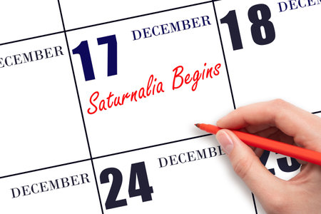 December 17. Hand writing text Saturnalia Begins on calendar date. Save the date. Holiday. Day of the year concept.の写真素材