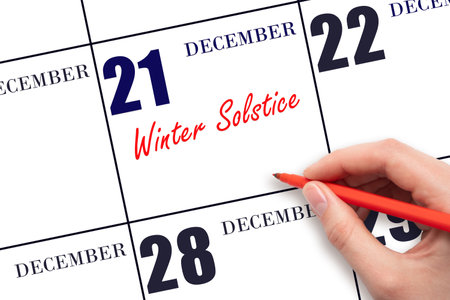 December 21. Hand writing text Winter Solstice on calendar date. Save the date. Holiday. Day of the year concept.の写真素材