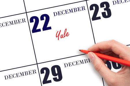 December 22. Hand writing text Yule on calendar date. Save the date. Holiday. Day of the year concept.の写真素材