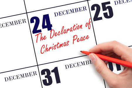 December 24. Hand writing text The Declaration of Christmas Peace on calendar date. Save the date. Holiday. Day of the year concept.の写真素材
