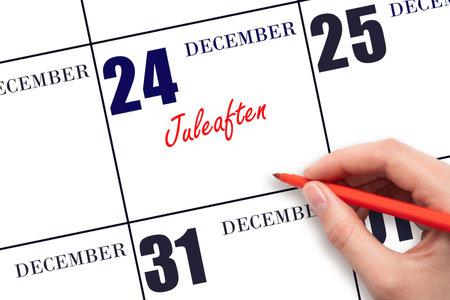 December 24. Hand writing text Juleaften on calendar date. Save the date. Holiday. Day of the year concept.の写真素材