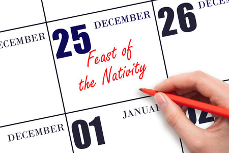 December 25. Hand writing text Feast of the Nativity on calendar date. Save the date. Holiday. Day of the year concept.の写真素材