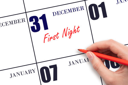December 31. Hand writing text First Night on calendar date. Save the date. Holiday. Day of the year concept.の写真素材