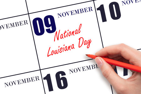 November 9. Hand writing text National Louisiana Day on calendar date. Save the date. Holiday. Important date. Day of the year concept.の写真素材