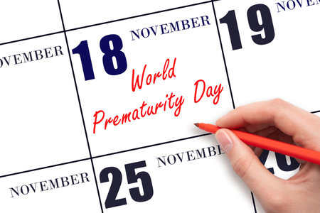 November 18. Hand writing text World Prematurity Day on calendar date. Save the date. Holiday. Important date. Day of the year concept.の写真素材