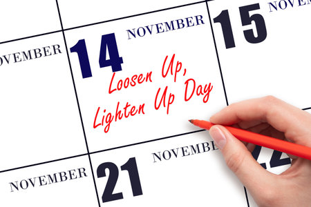 November 14. Hand writing text Loosen Up, Lighten Up Day on calendar date. Save the date. Holiday. Important date. Day of the year concept.の写真素材