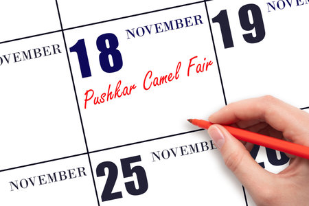 November 18. Hand writing text Pushkar Camel Fair on calendar date. Save the date. Holiday. Important date. Day of the year concept.の写真素材