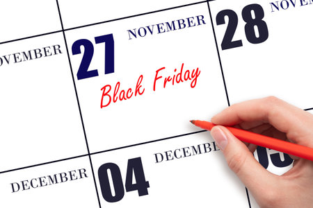 November 27. Hand writing text on calendar date. Save the date. Holiday. Important date. Day of the year concept.の写真素材
