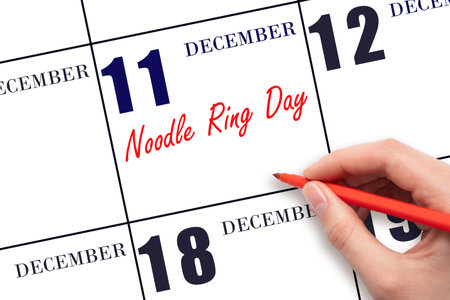 December 11. Hand writing text Noodle Ring Day on calendar date. Save the date. Holiday. Day of the year concept.の写真素材