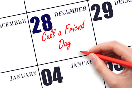December 28. Hand writing text Call a Friend Day on calendar date. Save the date. Holiday. Day of the year concept.の写真素材