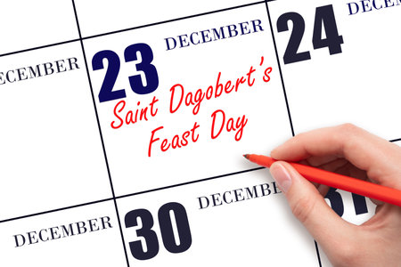 December 23. Hand writing text Saint Dagobert's Feast Day on calendar date. Save the date. Holiday. Day of the year concept.の写真素材