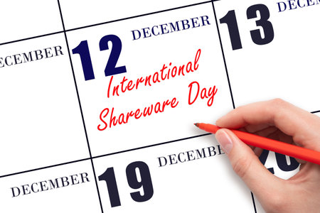 December 12. Hand writing text International Shareware Day on calendar date. Save the date. Holiday. Day of the year concept.の写真素材