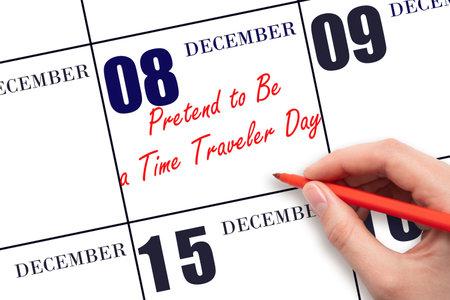 December 8. Hand writing text Pretend to Be a Time Traveler Day on calendar date. Save the date. Holiday. Day of the year concept.の写真素材