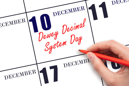 December 10. Hand writing text Dewey Decimal System Day on calendar date. Save the date. Holiday. Day of the year concept.の写真素材