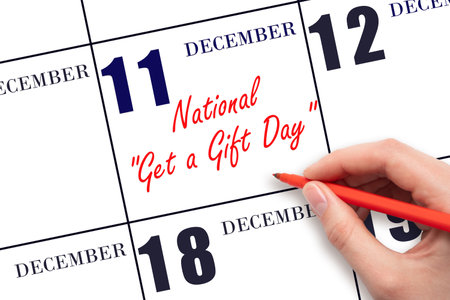 December 11. Hand writing text National Get a Gift Day on calendar date. Save the date. Holiday. Day of the year concept.の写真素材