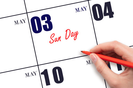 May 3. Hand writing text Sun Day on calendar date. Save the date. Holiday. Planning or scheduling concept.の写真素材