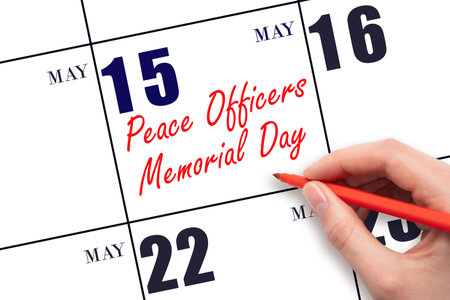 May 15. Hand writing text Peace Officers Memorial Day on calendar date. Save the date. Holiday.  Planning or scheduling concept.の写真素材