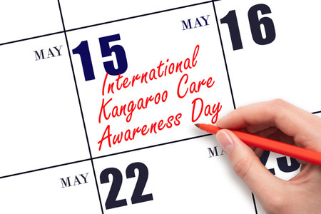 May 15. Hand writing text International Kangaroo Care Awareness Day on calendar date. Save the date. Holiday. Planning or scheduling concept.の写真素材