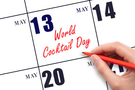 May 13. Hand writing text World Cocktail Day on calendar date. Save the date. Holiday. Planning or scheduling concept.の写真素材
