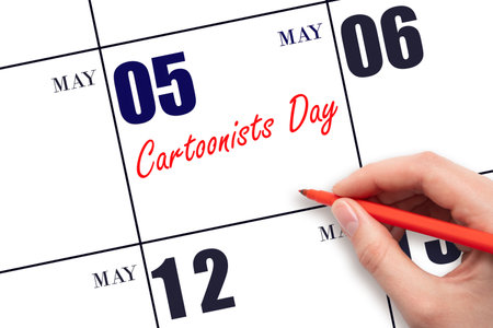 May 5. Hand writing text Cartoonists Day on calendar date. Save the date. Holiday. Planning or scheduling concept.の写真素材