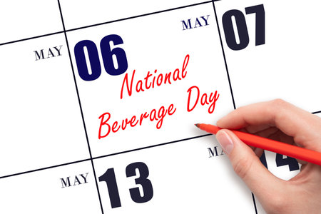 May 6. Hand writing text National Beverage Day on calendar date. Save the date. Holiday. Planning or scheduling concept.の写真素材