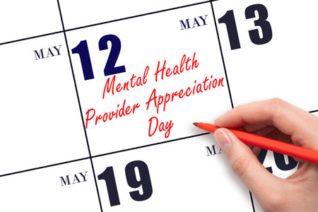 May 12. Hand writing text National Mental Health Provider Appreciation Day on calendar date. Save the date. Holiday.  Planning or scheduling concept.の写真素材