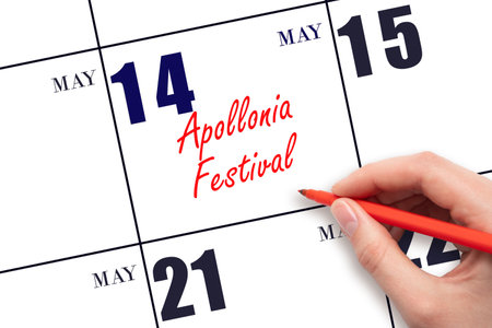 May 14. Hand writing text Apollonia Festival on calendar date. Save the date. Holiday.  Planning or scheduling concept.の写真素材
