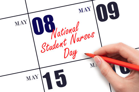 May 8. Hand writing text National Student Nurses Day on calendar date. Save the date. Holiday.  Planning or scheduling concept.の写真素材