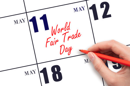 May 11. Hand writing text World Fair Trade Day on calendar date. Save the date. Holiday. Planning or scheduling concept.の写真素材