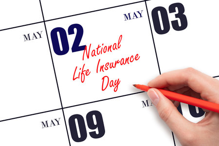May 2. Hand writing text National Life Insurance Day on calendar date. Save the date. Holiday.  Planning or scheduling concept.の写真素材