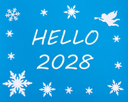New Year's greeting card. The text HELLO 2028 on a blue background with Christmas snowflakes, a white angel. Happy New Year.の写真素材