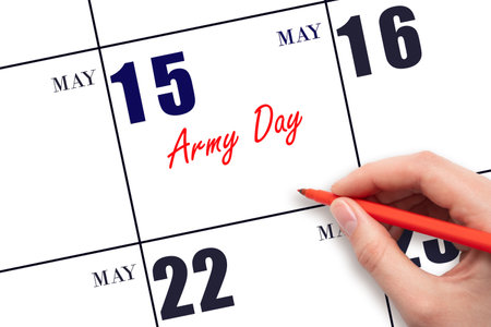 May 15. Hand writing text Army Day on calendar date. Save the date. Holiday.  Planning or scheduling concept.の写真素材