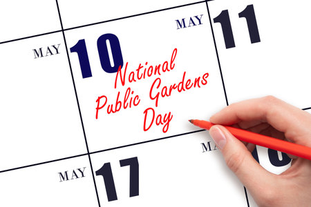 May 10. Hand writing text National Public Gardens Day on calendar date. Save the date. Holiday. Planning or scheduling concept.の写真素材