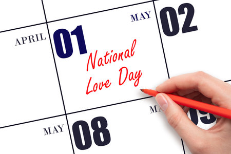 May 1. Hand writing text National Love Day on calendar date. Save the date. Holiday.  Planning or scheduling concept.の写真素材