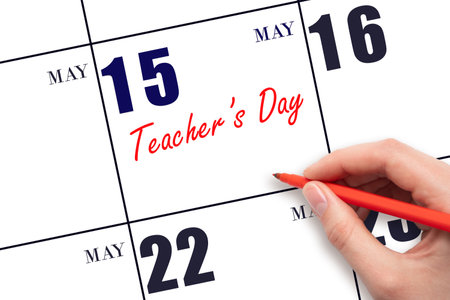 May 15. Hand writing text Teacher's Day on calendar date. Save the date. Holiday. Planning or scheduling concept.の写真素材