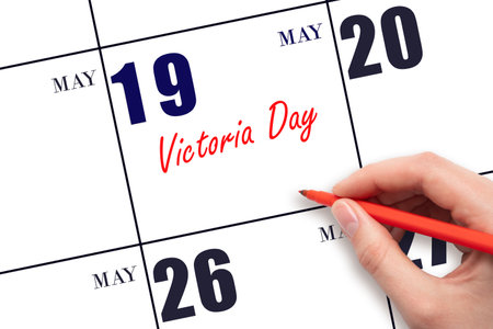 May 19. Hand writing text Victoria Day on calendar date. Save the date. Holiday. Planning or scheduling concept.の写真素材