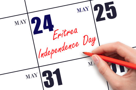 May 24. Hand writing text Eritrea Independence Day on calendar date. Save the date. Holiday.  Planning or scheduling concept.の写真素材