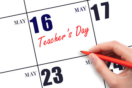 May 16. Hand writing text Teacher's Day on calendar date. Save the date. Holiday. Planning or scheduling concept.の写真素材