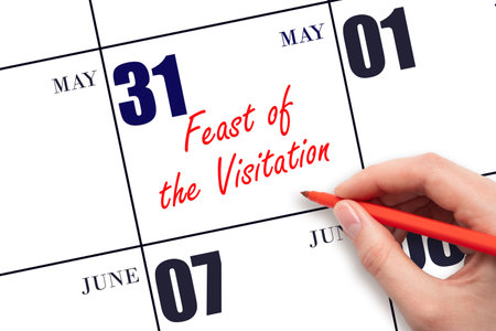May 31. Hand writing text Feast of the Visitation on calendar date. Save the date. Holiday.  Planning or scheduling concept.の写真素材