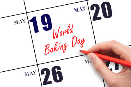 May 19. Hand writing text World Baking Day on calendar date. Save the date. Holiday. Planning or scheduling concept.の写真素材