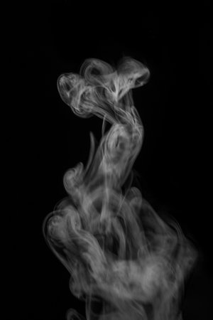 steam, smoke, gas isolated on a black background. graphic resource for montage, overlay or texture, toned. Swirling, writhing smoke to overlay on your photos. Smoky for Halloweenの写真素材