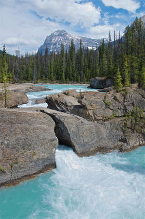Natural bridge over the Kicking Horse River it's a stone carved by water in Yoho National Park, British Columbia, Canadaの写真素材