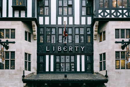 The front exterior and the sign above the entrance of Liberty Department Store. Opened in 1875 it is famous for luxury goods and classic Liberty designs.のeditorial素材