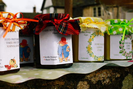 Homemade chutney, marmalade and jam for sale in small village of Lacock, England. Buyers are asked to pay for products into honesty box.のeditorial素材