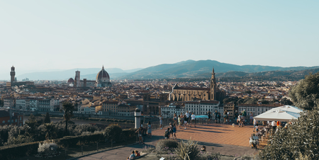 Florence skyline and sights from Piazzale Michelangelo, tourists on the viewing platform. Florence is home to many masterpieces of Renaissance art and architectureのeditorial素材