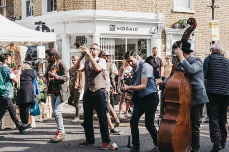 Band performing at the Columbia Road Flower Market, a street market in East London that is open every Sunday.のeditorial素材