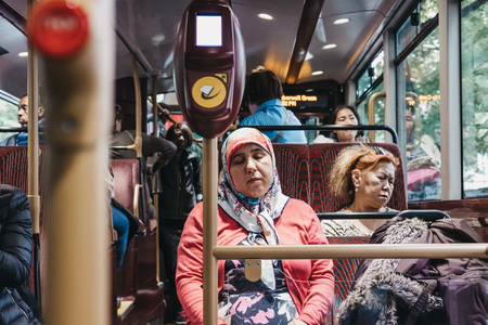 Passengers inside a New Routemaster, a hybrid diesel-electric double-decker bus operated in London, UK.のeditorial素材