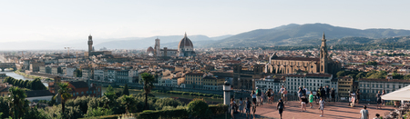 Panorama of Florence skyline from Piazzale Michelangelo, tourists on viewing platform. Florence is home to many masterpieces of Renaissance art and architectureのeditorial素材
