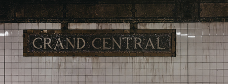 Grand Central subway station name on a wall inside the station. Grand Centralâ€“42nd Street is...